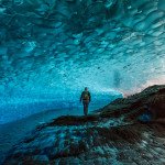 EKBXC8 Man in glacier cave, Mendenhall Glacier, Juneau, Alaska - Credit: Cultura RM/Alamy